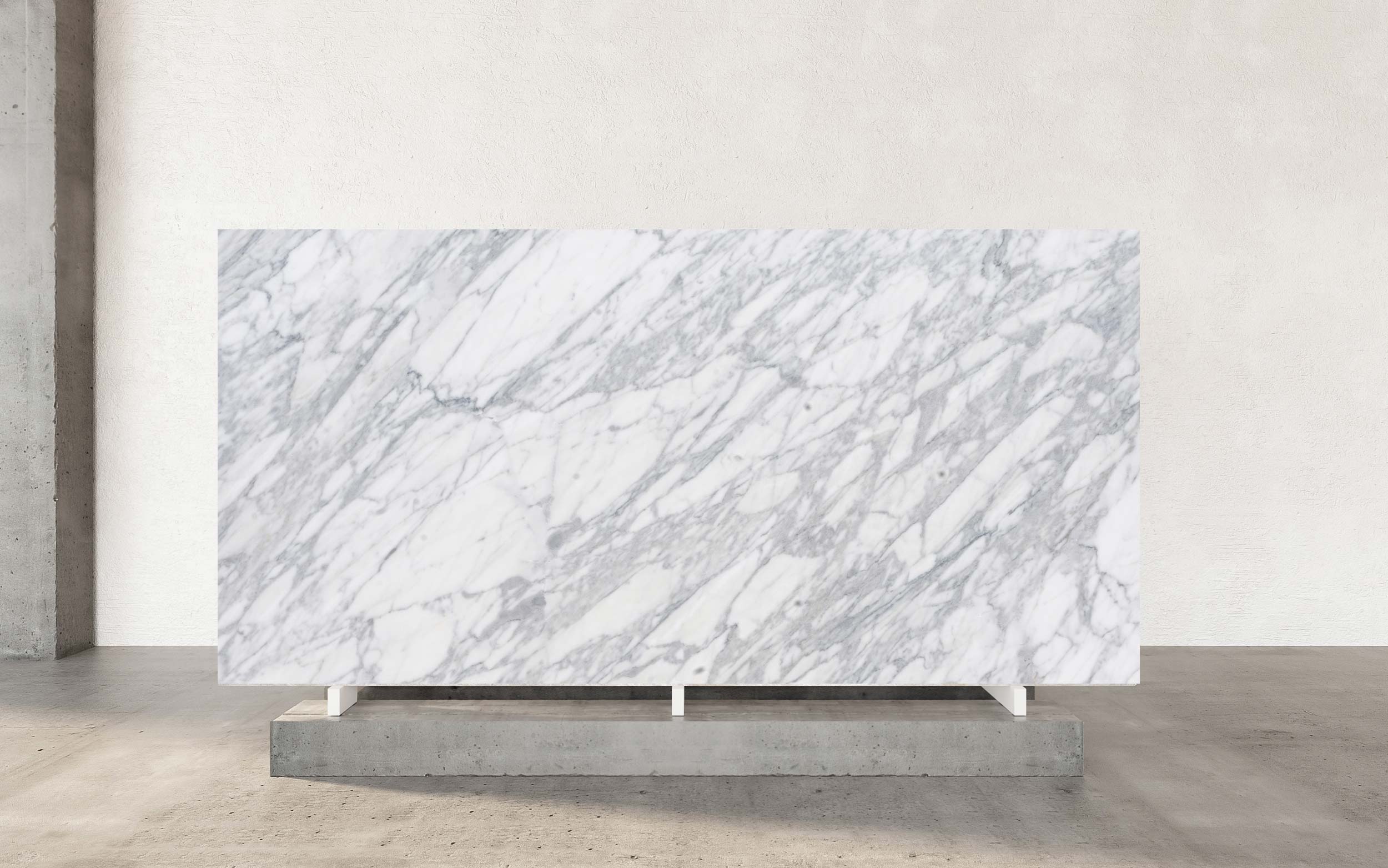 The color palette of Calacatta Apuano Marble is nothing short of breathtaking, showcasing a luminous white backdrop interwoven with bold, dramatic veins in shades of charcoal, soft gray, and occasionally golden hues. This striking interplay of tones creates an aura of timeless sophistication, evoking the allure of classic marble but with the enhanced durability of quartzite. Calacatta Apuano Marble is a masterpiece of natural beauty, originating from the renowned Apuan mountains in Italy—an area celebrated for its legacy of exquisite stone craftsmanship. This distinctive marble embodies the elegance and grandeur of its Italian heritage, making it a centerpiece of luxury in contemporary design.