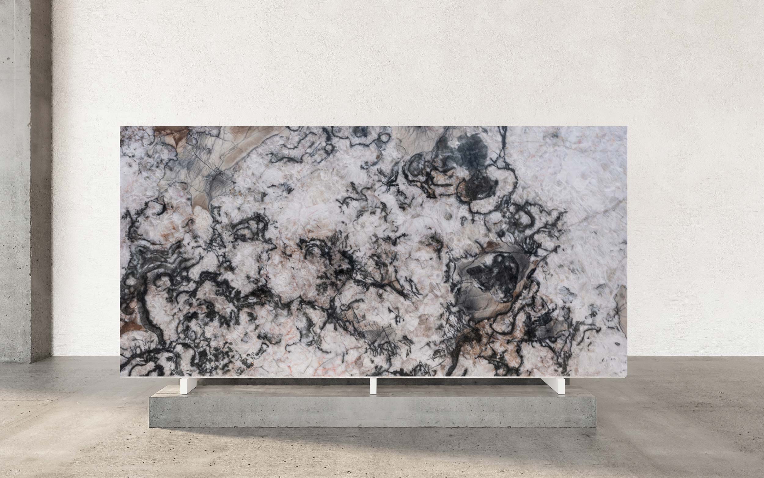 Camelot Quartzite presents a masterful blend of shadow and light, curated by nature for the most discerning tastes. Its polished surface reveals a captivating drama of swirling dark gray and black patterns, moving with a fluid, organic elegance across the slab. This dynamic interplay of deep, commanding tones creates a sense of sophisticated movement, turning any surface into a powerful statement of natural artistry. The stone's inherent depth and bold character make it a definitive choice for creating spaces with unforgettable visual impact. Beneath the powerful veining lies a subtle yet enchanting feature: a sugary crystalline base that imparts a delicate, granular texture. This unique foundation catches the light, adding a quiet shimmer and a tactile dimension that balances the stone's dramatic swirls. Camelot Quartzite's combination of bold movement and refined detail offers unparalleled versatility for luxury applications. It is an ideal selection for signature countertops, striking feature walls, or elegant fireplace, bringing a heritage of geological beauty and enduring strength to any premier design project.