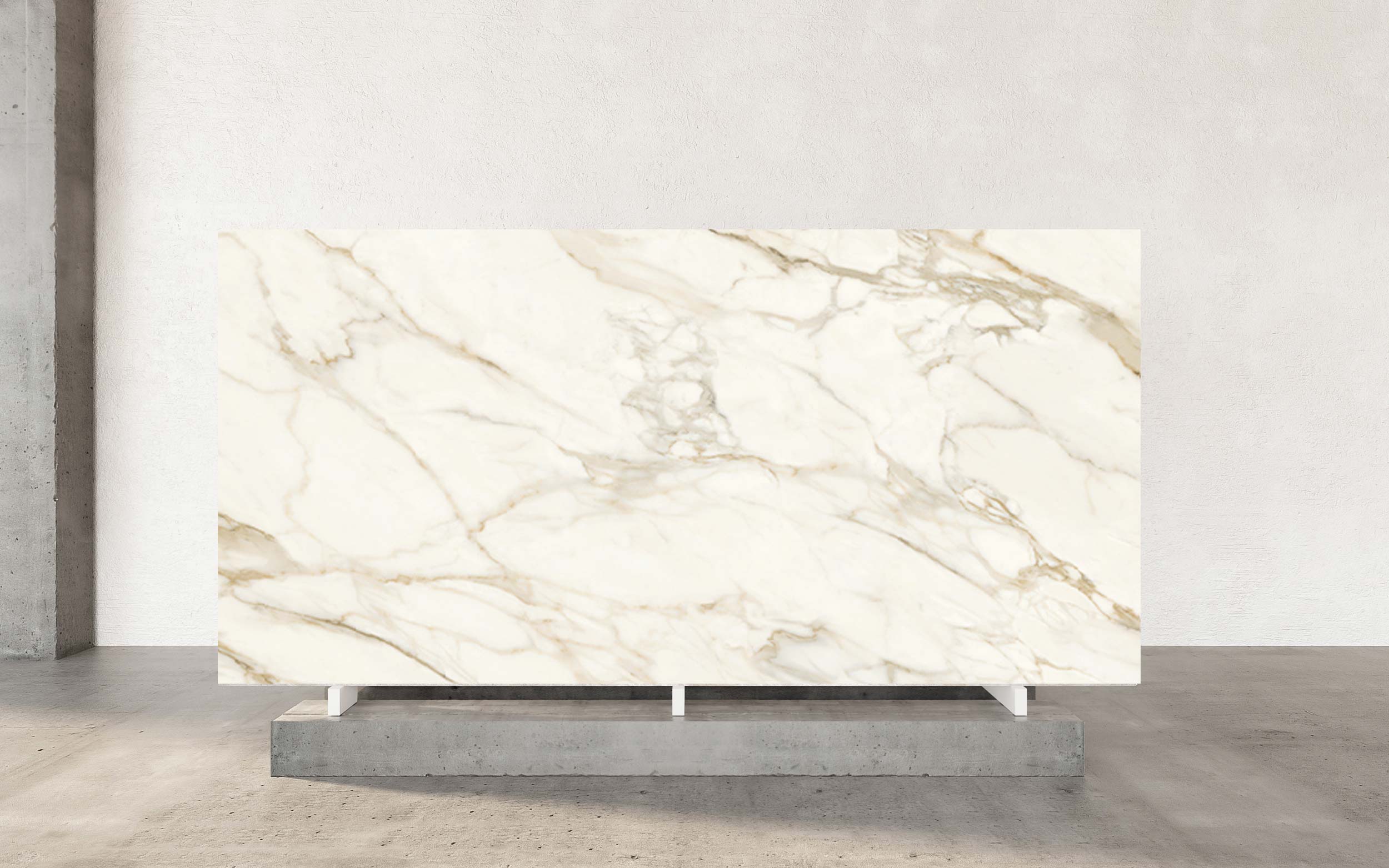 Rooted in the rich tradition of Italian artistry, Calacatta Venice porcelain sets a distinguished benchmark for sophisticated surface design. It features a luminous white background that serves as a pristine canvas for delicate, wandering veins of warm gold. The pattern is intentionally understated, offering a composition of refined movement without overwhelming the eye. This masterful balance ensures that Calacatta Venice imparts a sense of calm luxury, making it a distinguished choice for creating interiors of serene and lasting beauty. Available in both polished and honed finishes, Calacatta Venice adapts to any vision. The polished surface adds radiant shine and highlights every detail, while the honed option offers a soft, matte elegance. Both deliver timeless appeal, ensuring your space is refined and inviting.