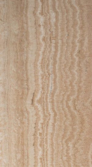 Navona Travertine, quarried near the historic town of Tivoli, Italy, is celebrated for its vein-cut linear pattern and creamy warmth. The filled and honed finish gives it a smooth, matte surface that highlights delicate bands and softens reflections for a serene, refined appearance. Its versatile nature makes it ideal for floors, walls, countertops, and backsplashes, delivering timeless visual flow and practicality to both modern and classic interiors.