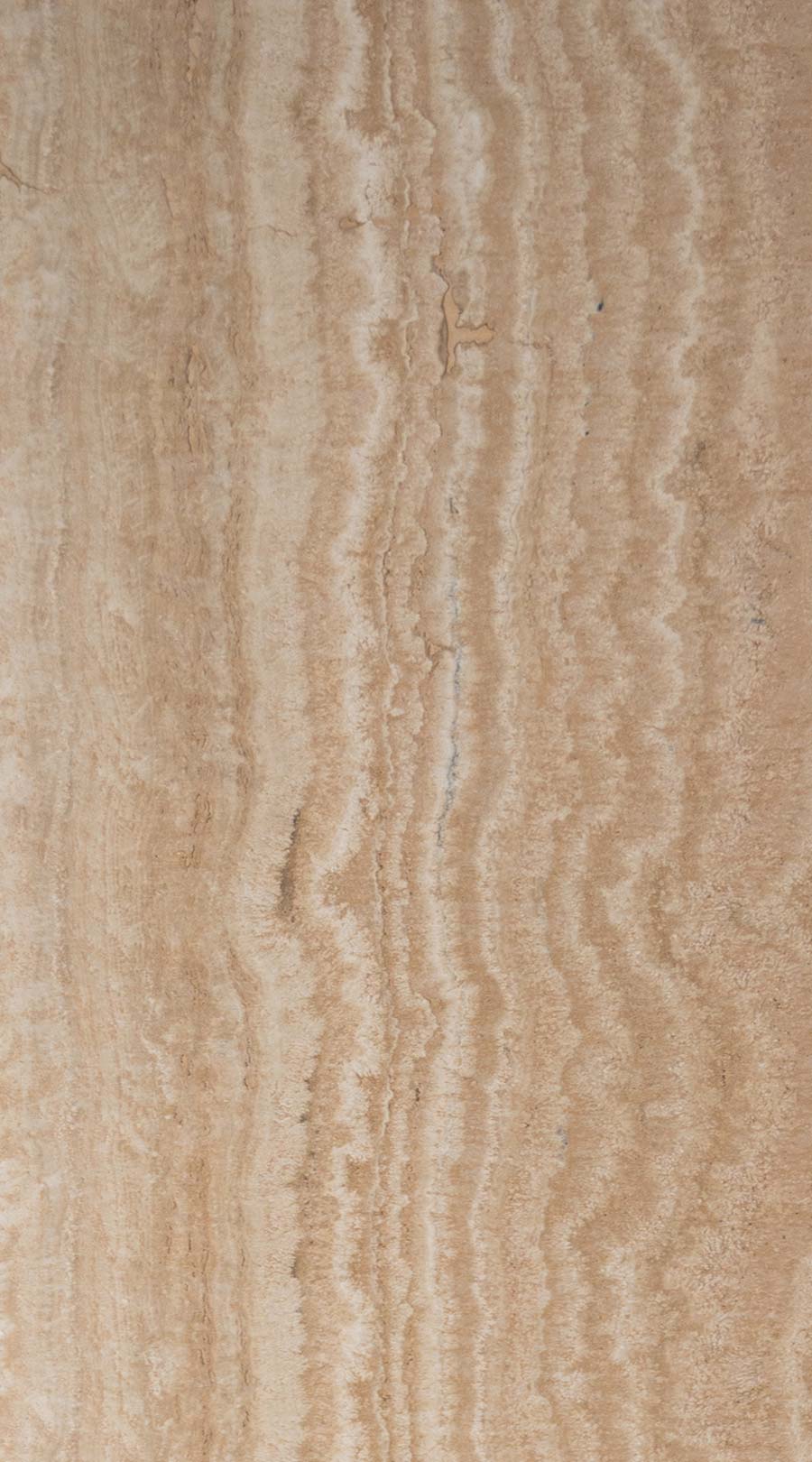 Navona Travertine, quarried near the historic town of Tivoli, Italy, is celebrated for its vein-cut linear pattern and creamy warmth. The filled and honed finish gives it a smooth, matte surface that highlights delicate bands and softens reflections for a serene, refined appearance. Its versatile nature makes it ideal for floors, walls, countertops, and backsplashes, delivering timeless visual flow and practicality to both modern and classic interiors.